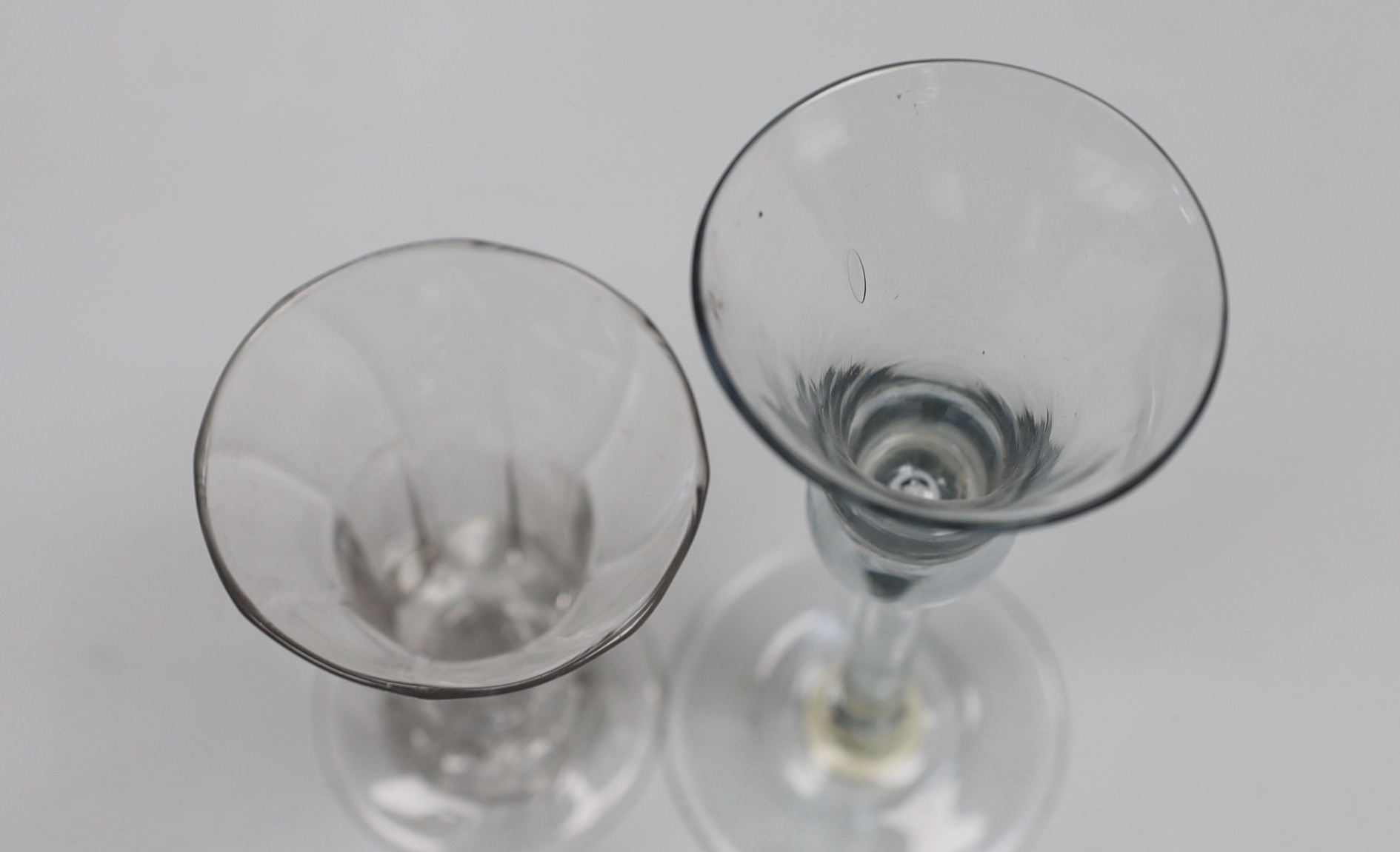 A George II wine glass, bell bowl with air-tear, and a George II syllabub glass, tallest 16cm